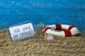 Message in a bottle with the german words for we are on holiday - wir sind im urlaub Royalty Free Stock Photo