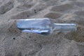 Message in a bottle in the sand of Brittany beach