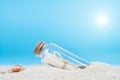 Message in a bottle on the sand of th beach Royalty Free Stock Photo