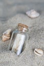 Message in a bottle on the sand of th beach Royalty Free Stock Photo