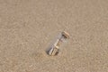 Message in a bottle on a sandy beach Royalty Free Stock Photo
