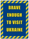 Message Brave enough to Visit Ukraine inside Ukrainian flag frame Royalty Free Stock Photo