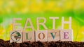 Message earth love made of wooden blocks