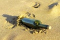 Message in a glass bottle in a beach Royalty Free Stock Photo