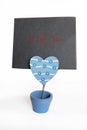 Message holder with a greeting card isolated on white. I love you, ValentineÃ¢â¬â¢s day.