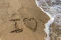 The Word love you Written in the Sand on a Beach Royalty Free Stock Photo