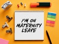 The message I am on maternity leave written on a notebook on business office desktop Royalty Free Stock Photo