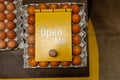 Open Yellow Box Among Brown Eggs Royalty Free Stock Photo