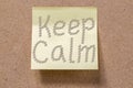 message Keep Calm drawn with coffee beans on memory note Royalty Free Stock Photo