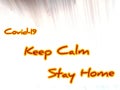 Message keep calm stay home on Blackboard in an abstractly blurred photo,corona messages, computer cloud covid 19