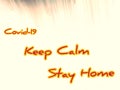 Message keep calm stay home on Blackboard in an abstractly blurred photo,corona messages, computer cloud covid 19