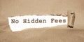 The message No Hidden Fees appearing behind torn brown paper. Business concept Royalty Free Stock Photo