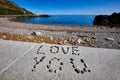 Message in pebbles on beach
