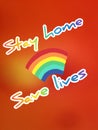 Message stay home save lives  written on Blackboard in an abstractly blurred photo of the fire, Covid-19 cloud Royalty Free Stock Photo