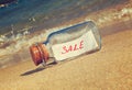 Message in a vintage bottle Sale on beach