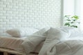 Messed bed with white pillow and blanket with natural light Royalty Free Stock Photo