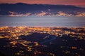 Messina strait and Reggio Calabria city lights at dusk