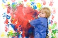 Messing about with finger paint Royalty Free Stock Photo