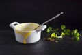 Messthetics aesthetic concept. Dish ready for washing. A photo of dirty empty ceramic bowl, spoon and some parsley. Porridge, Royalty Free Stock Photo