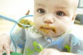 Messy Baby Being Fed Royalty Free Stock Photo