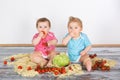 Messy baby toddlers having fun eating