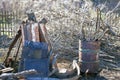 Messy backyard with two metal barrels