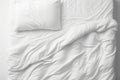 Messy Bed Concept With White Bedding Sheets And Pillow Royalty Free Stock Photo