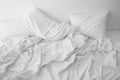 Messy Bed Concept With White Bedding Sheets And Pillow Royalty Free Stock Photo