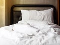 Messy bed with white pillow, blanket and bed cover sheeet. Relax Royalty Free Stock Photo