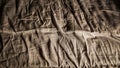 A messy bed with wrinkled sheets and high contrast at night Royalty Free Stock Photo