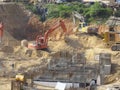 Messy and busy construction site. Commencing with ground and foundation work.