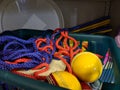 A messy disorganised basket of coloured cord rope in a school games storage cupboard Royalty Free Stock Photo