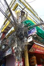 Messy electrical wiring over a post, Kathmandu, Nepal