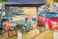 Messy family campsite with chairs table and other things