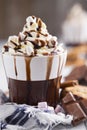 Messy hot chocolate, cream and marshmallows Royalty Free Stock Photo