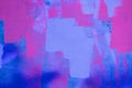 Messy paint strokes and smudges on an old painted wall. Pink, purple, blue color drips, flows, streaks of paint and