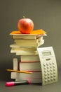 Messy pile of school books with red apple Royalty Free Stock Photo