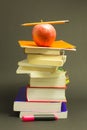 Messy pile of school books with red apple Royalty Free Stock Photo