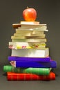 Messy pile of school books with red apple Royalty Free Stock Photo