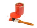 Red paint can with spilled paint and paintbrush isolated on white background Royalty Free Stock Photo