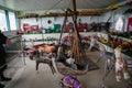 Messy room of vintage American toys and wooden rocking horses