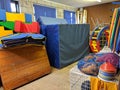 A messy sports hall equipment storage area Royalty Free Stock Photo