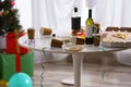 Messy table with cups, bottles and pizza. Chaos after party Royalty Free Stock Photo