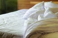 Messy unmade bed with wrinkled sheets Royalty Free Stock Photo