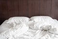 Messy and unmade white hotel bed at hotel room in holiday morning Royalty Free Stock Photo