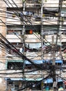 16.08.2017.Messy wires attached to the electric pole, the chaos of cables and wires on an electric pole in Bangkok with dilapidate