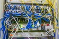 Messy wires are in a rack with servers and Internet equipment