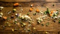 Messy wooden floor scattered with rice grains and vegetable bits after baby first solid feeding Royalty Free Stock Photo