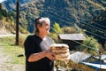 Old woman holds a traditional georgian bread Royalty Free Stock Photo