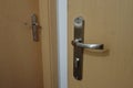 Metail door handle on a modern door Royalty Free Stock Photo